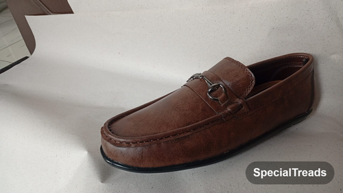 Brown horsebit loafer side profile view