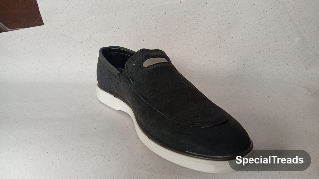 Navy suede slip-on loafer side view with white sole