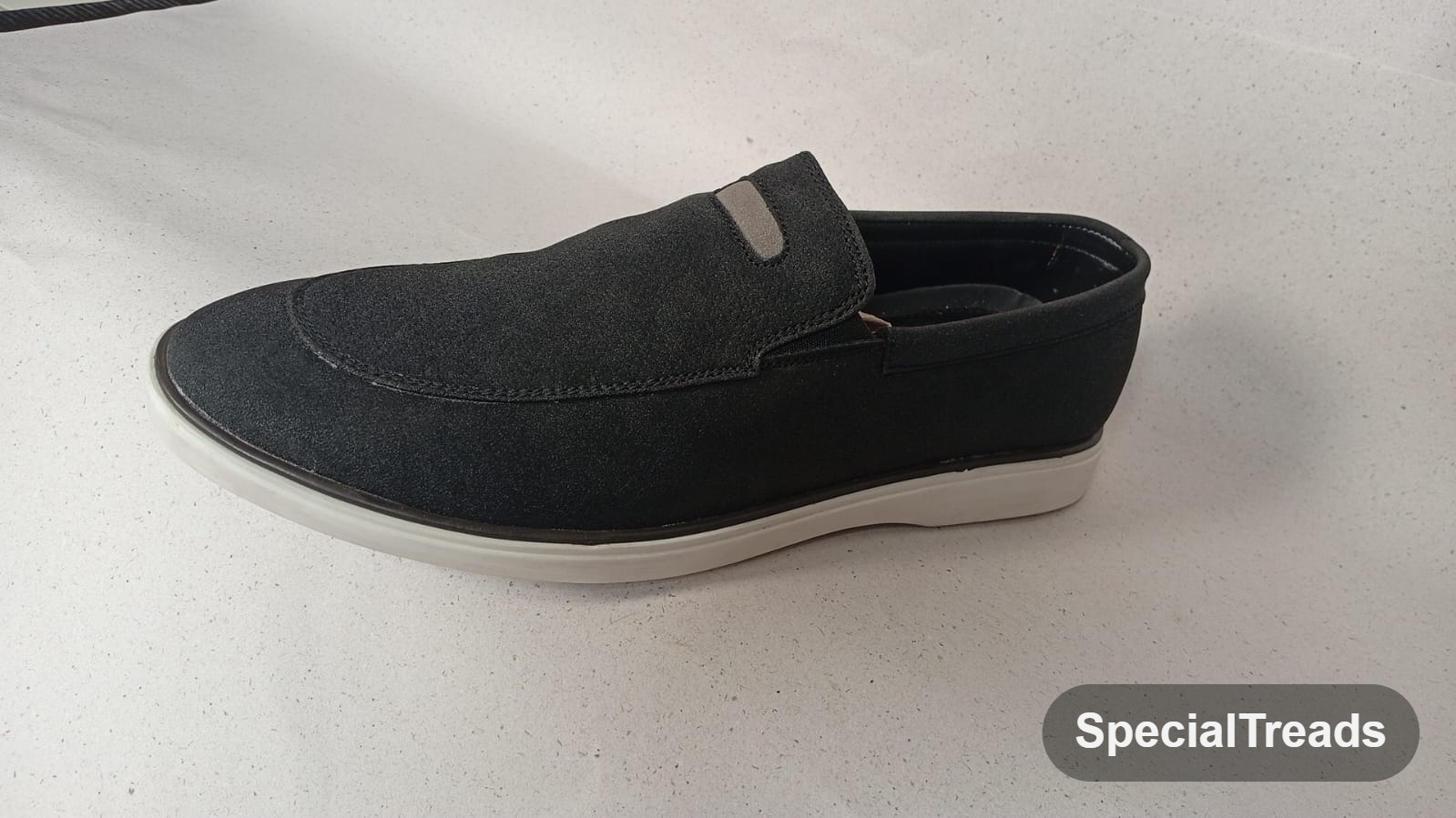 Navy suede slip-on loafer full side profile on white background
