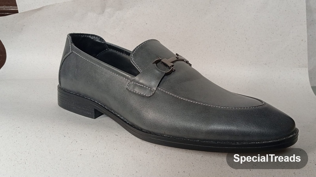 Grey leather horsebit loafer with contrast stitching and stacked heel