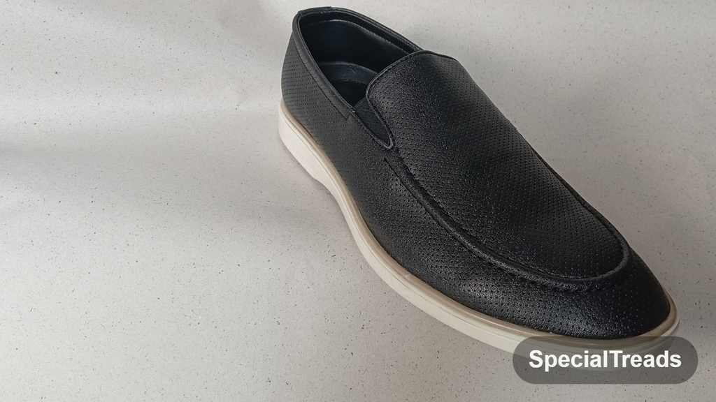 Black perforated slip-on loafer with white chunky sole