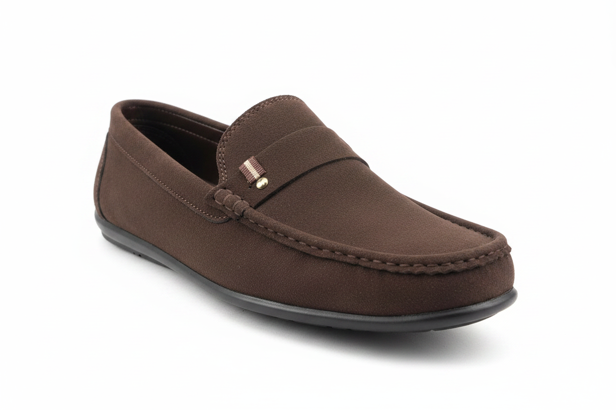 Dark brown suede loafer angled front view showing gold pin detail