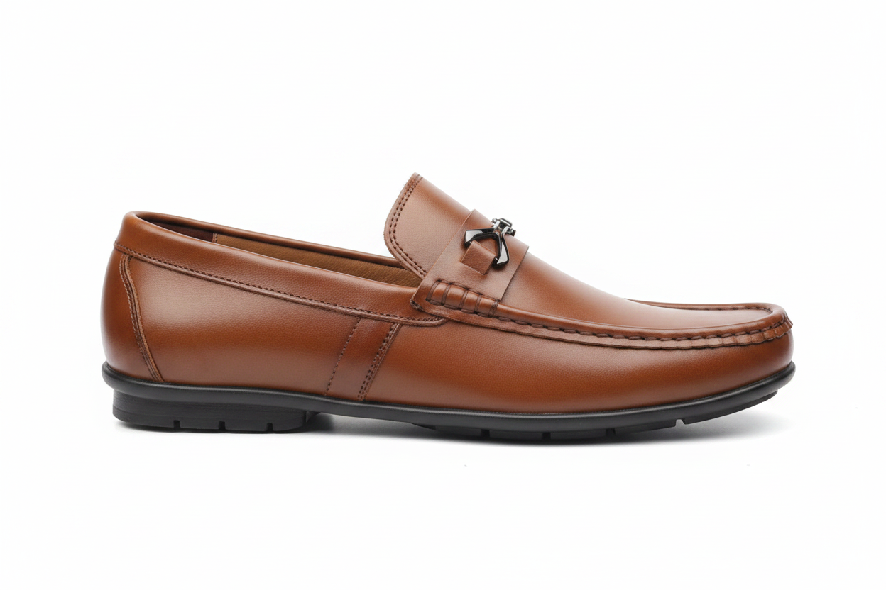 Tan cognac bit loafer side profile on white background