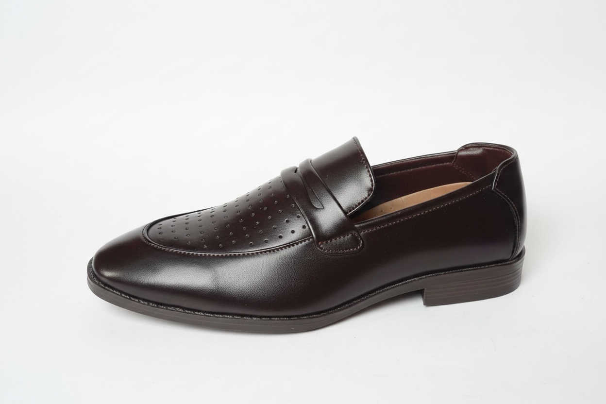 Dark brown perforated penny loafer side profile on white background